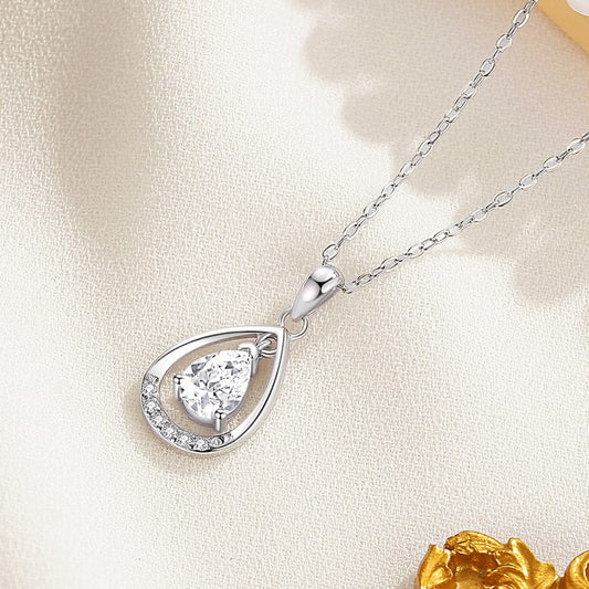 Close-up of Angel Tears pendant necklace, promoting protection and peace