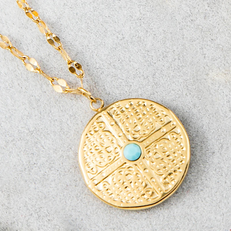 Close up blue drop oil evil eye pendant cross necklace detail