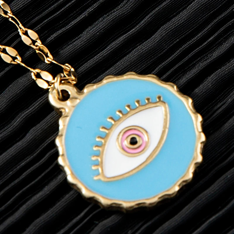 Stylish women’s cross necklace with blue evil eye charm pendant