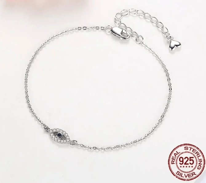Sterling Silver 925 Evil Eye Bracelet on white background, protection jewelry